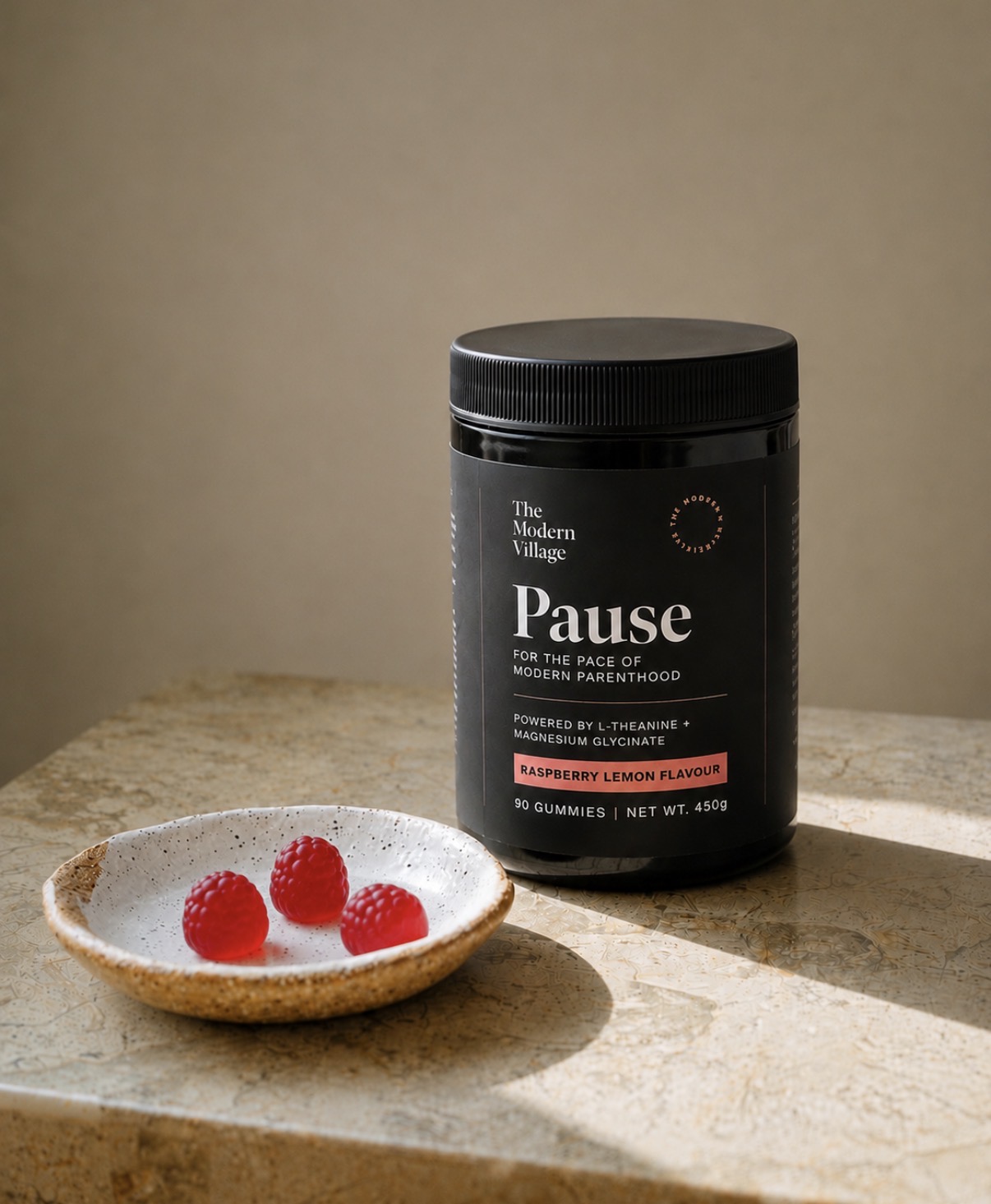 Pause raspberry-lemon gummies beside the jar.