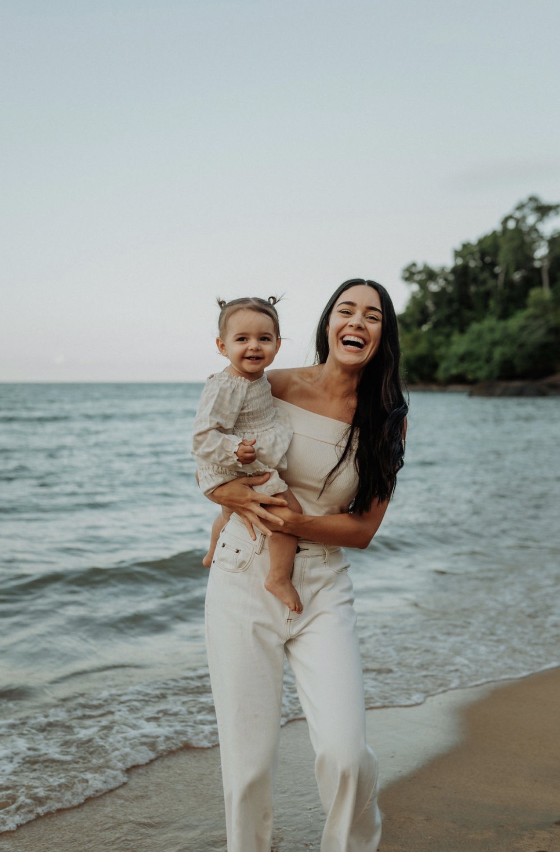 The founder of The Modern Village with her family on the beach